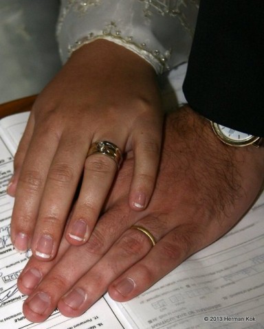 Hands with wedding rings