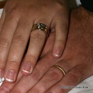 Hands with wedding rings